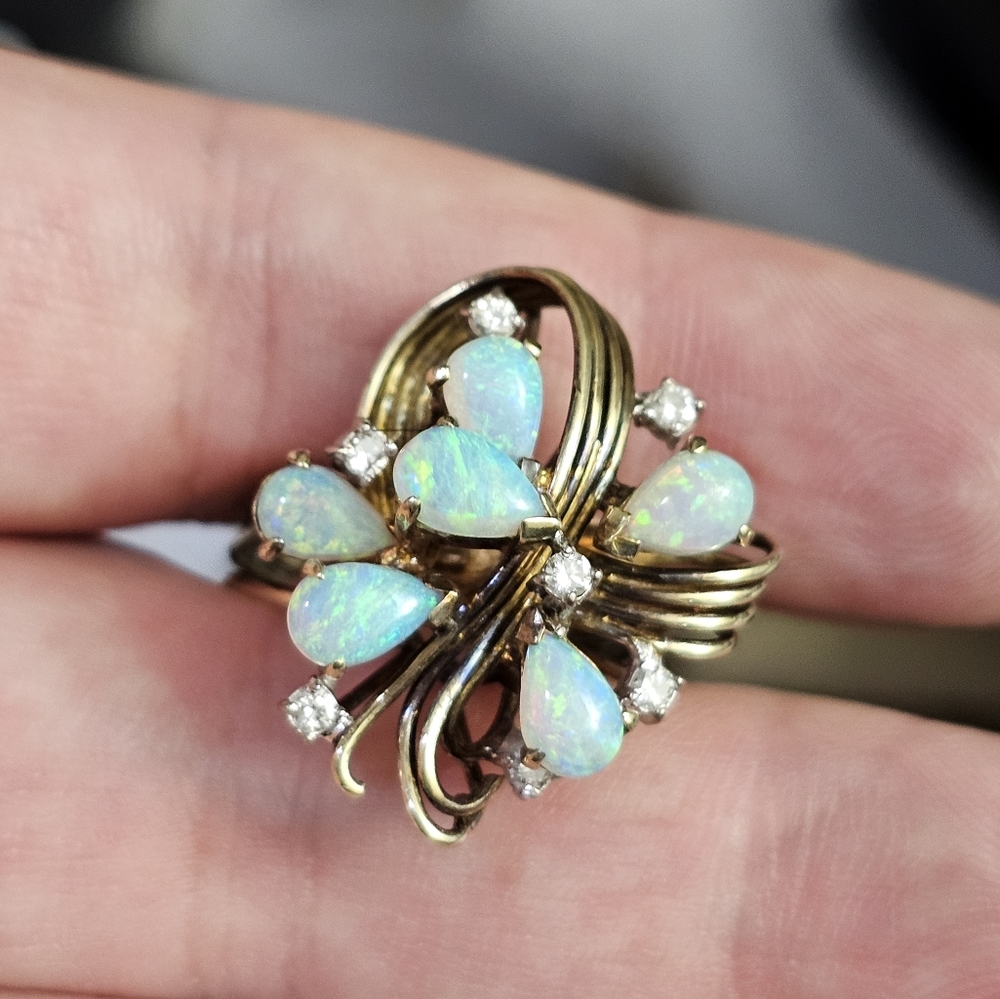 14k opal & diamond ring size 7. This is a large ring! The opals are amazing with